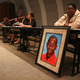 Andrew Joseph Jr. sits behind a picture of his deceased son, Andrew Joseph III, at a Black Lives Matter forum at John Germany Library in Tampa, Fla., on Wednesday, Sept. 9, 2015. A Florida sheriff has been ordered by a jury to pay $15 million to the parents of Andrew Joseph III, a teenager who died while trying to cross a highway after being kicked out of the state fair by deputies. The 10-person jury reached its verdict Thursday, Sept. 22, 2022.